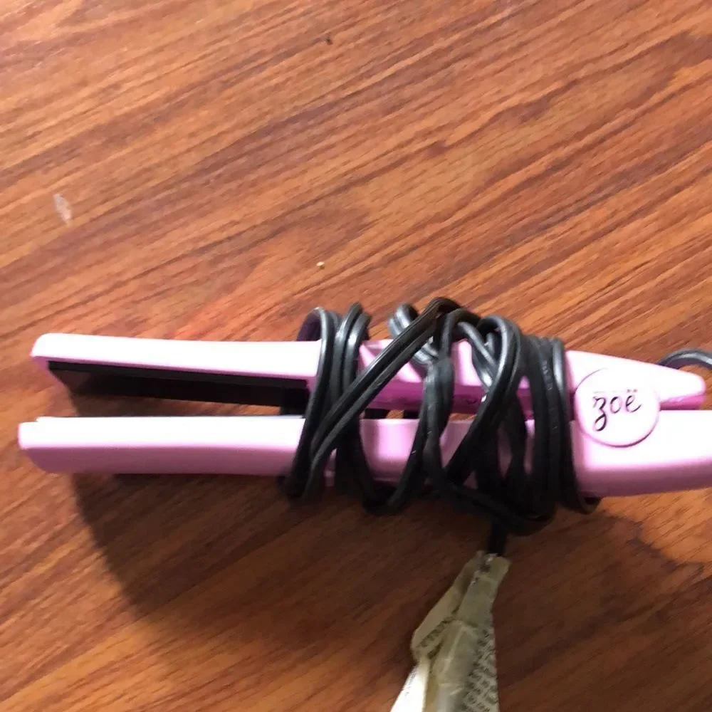 ZOE mini pink flat iron travel iron.
